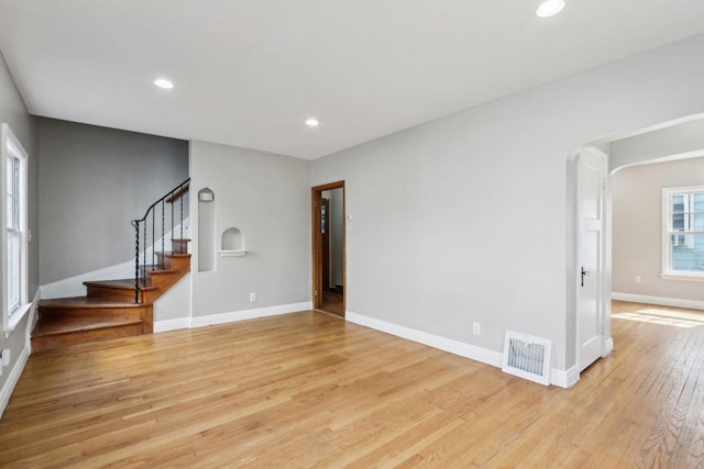 unfurnished living room with light hardwood / wood-style flooring