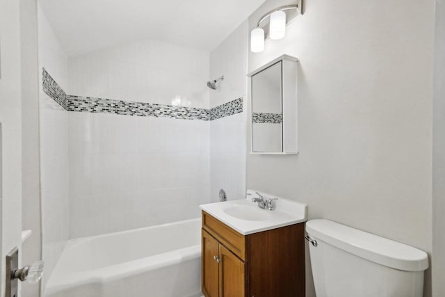 full bathroom featuring vanity, toilet, and tiled shower / bath