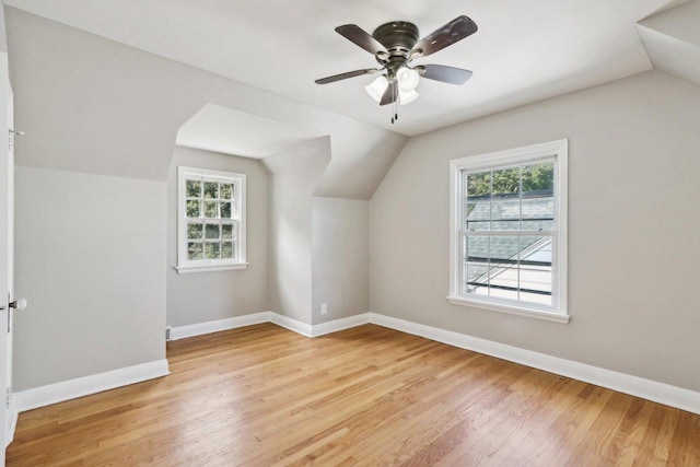 bonus room featuring light hardwood / wood-style flooring, lofted ceiling, and ceiling fan