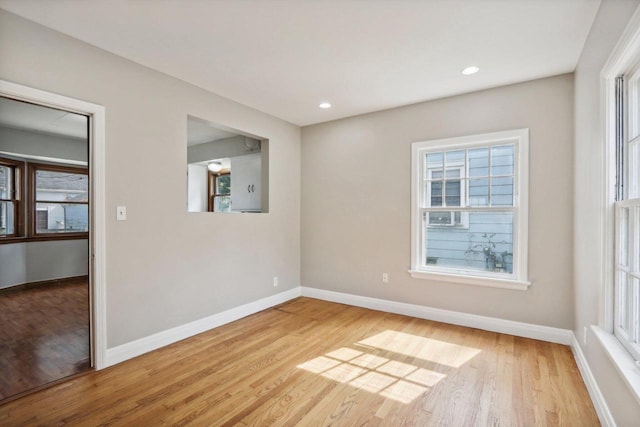 unfurnished room with light hardwood / wood-style floors