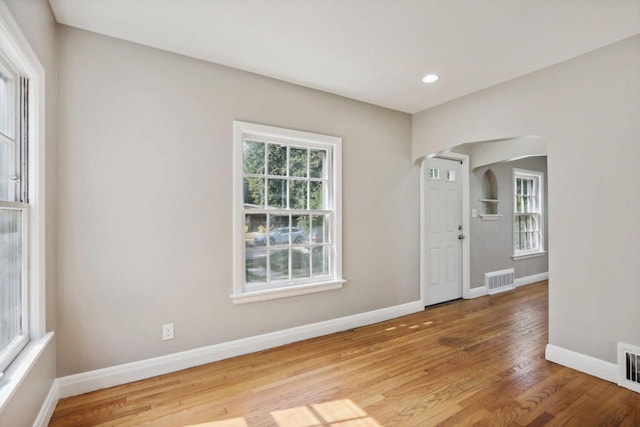 unfurnished room featuring light hardwood / wood-style floors