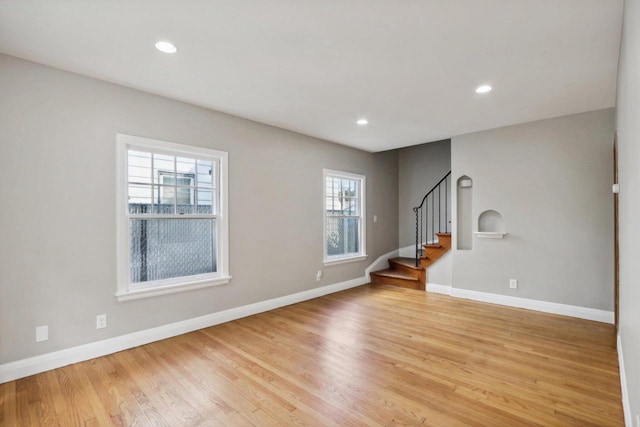 unfurnished living room featuring light wood-type flooring