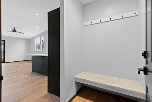 mudroom with light hardwood / wood-style flooring, ceiling fan, and vaulted ceiling