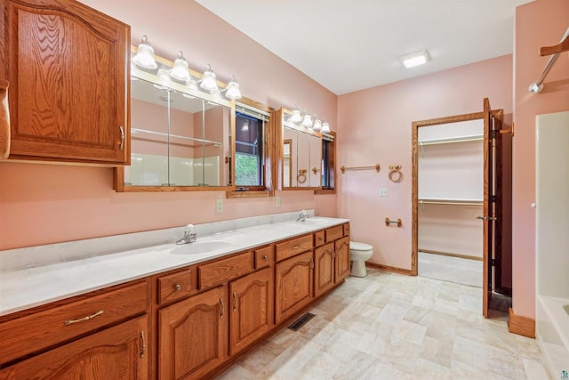 full bathroom featuring independent shower and bath, vanity, and toilet