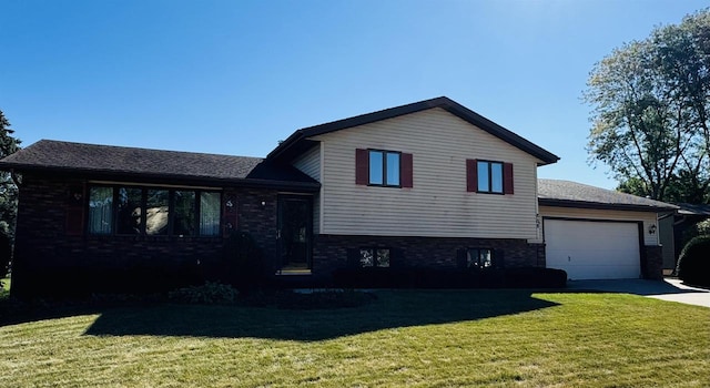 split level home with a garage and a front yard