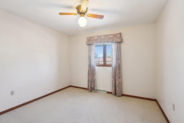 unfurnished room featuring ceiling fan and light colored carpet