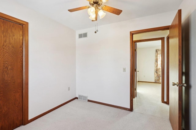 carpeted empty room with ceiling fan