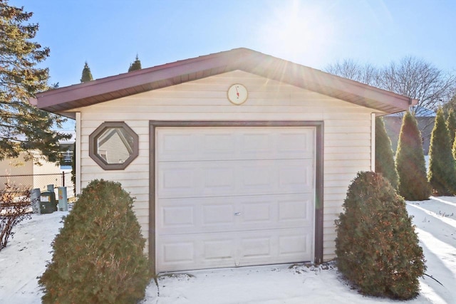 view of snow covered garage