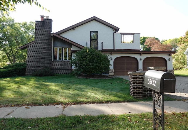 view of front facade featuring a front lawn and a garage