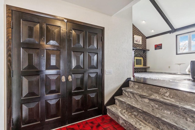 foyer entrance featuring vaulted ceiling