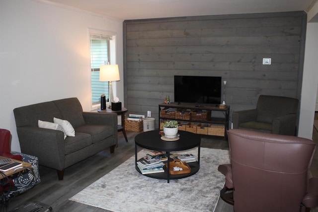 living room with ornamental molding and hardwood / wood-style floors