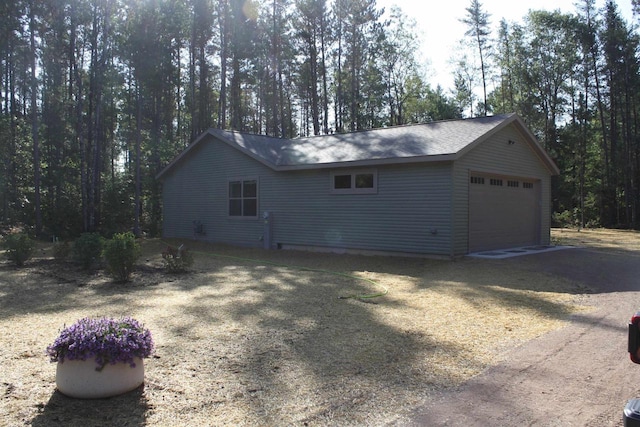 view of property exterior featuring a garage