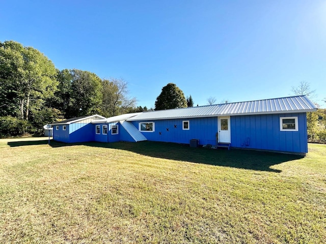 exterior space featuring a yard and central AC unit