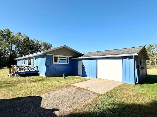 rear view of property featuring a deck and a lawn