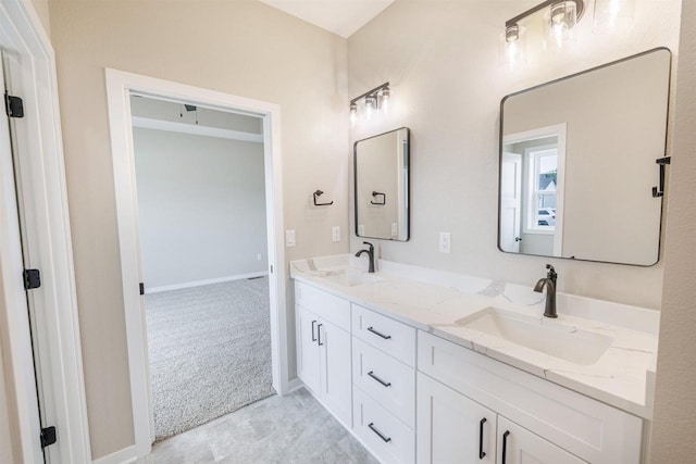 167 E Ash Ln, Milton, WI 53563 - full bath featuring double vanity and baseboards