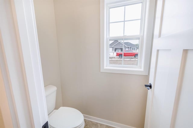 167 E Ash Ln, Milton, WI 53563 - bathroom featuring toilet and baseboards