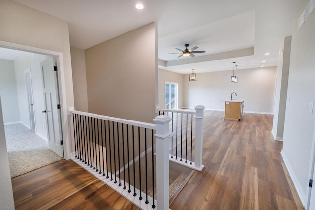 889 Red Hawk Dr, Milton, WI 53563 - corridor with an upstairs landing, wood finished floors, and recessed lighting