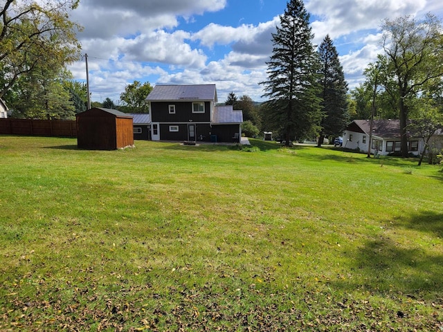 view of yard with a storage shed