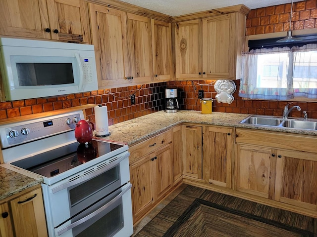 kitchen with light stone counters, a textured ceiling, sink, electric stove, and backsplash