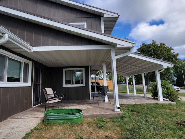 back of property featuring a patio area and a yard