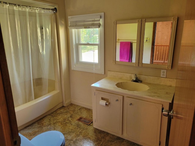 full bathroom with vanity, toilet, and shower / bath combo with shower curtain