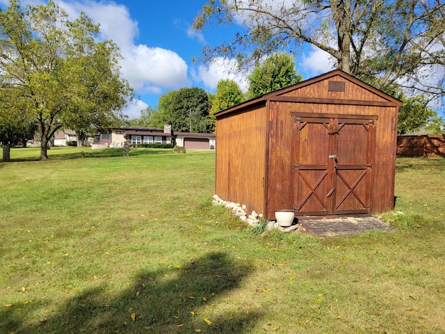 view of outdoor structure with a yard