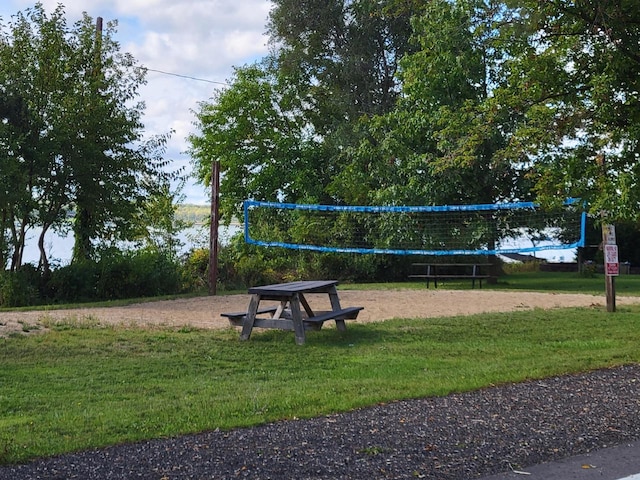 view of home's community with a yard