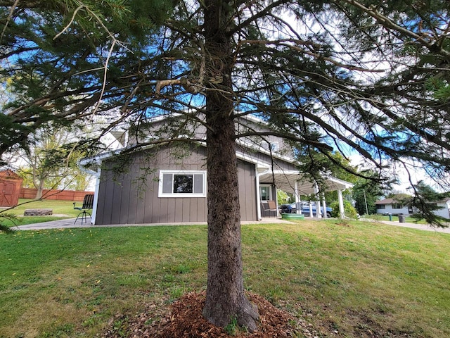 view of property exterior with a yard