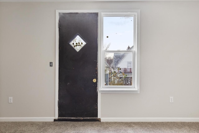 view of carpeted entrance foyer