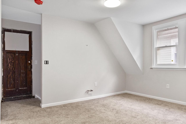 bonus room featuring carpet flooring and vaulted ceiling