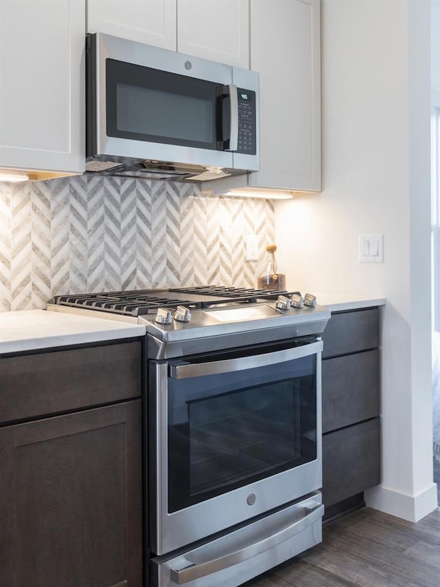 1295 Stonehaven Dr, Sun Prairie, WI 53590 - kitchen featuring tasteful backsplash, light countertops, and appliances with stainless steel finishes