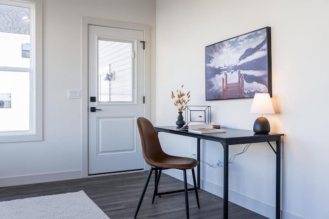 1295 Stonehaven Dr, Sun Prairie, WI 53590 - home office with dark wood-style flooring and baseboards