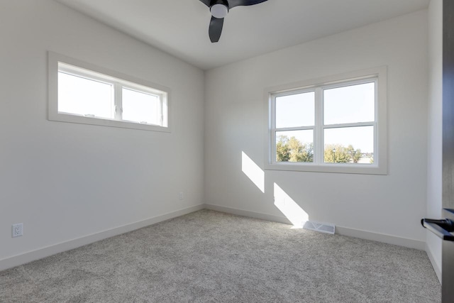 1295 Stonehaven Dr, Sun Prairie, WI 53590 - carpeted spare room featuring visible vents, baseboards, and a ceiling fan