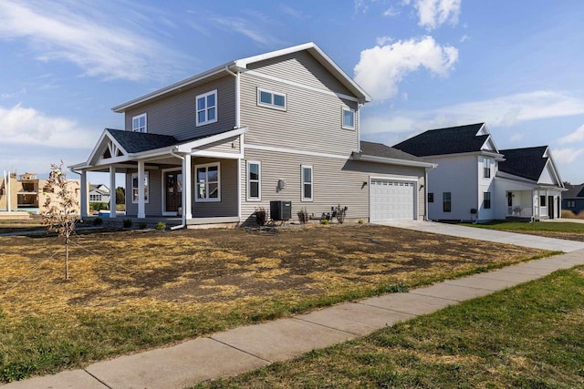 view of front facade featuring cooling unit, a porch, a front yard, and a garage