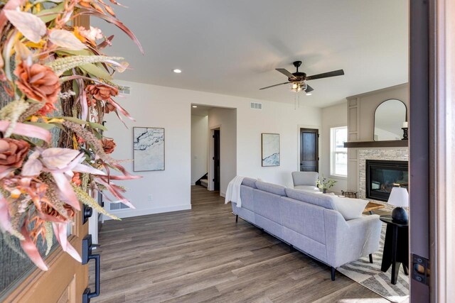 1295 Stonehaven Dr, Sun Prairie, WI 53590 - living area with ceiling fan, a fireplace, visible vents, recessed lighting, and wood finished floors