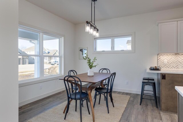 1295 Stonehaven Dr, Sun Prairie, WI 53590 - dining area featuring wood finished floors and baseboards