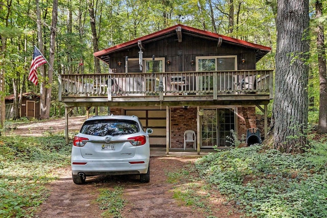 view of front of property with a wooden deck