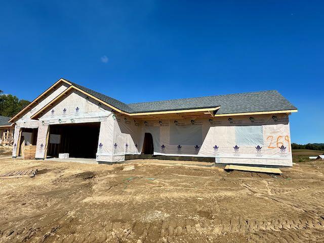 property in mid-construction featuring a garage