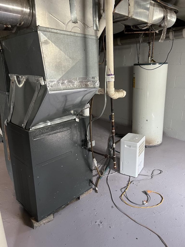 utility room with water heater and heating unit