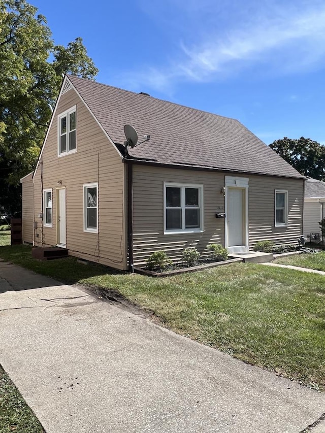 view of front of home with a front yard