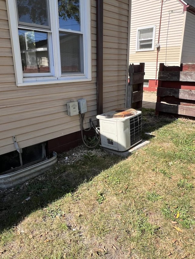 details with central AC unit and wood walls