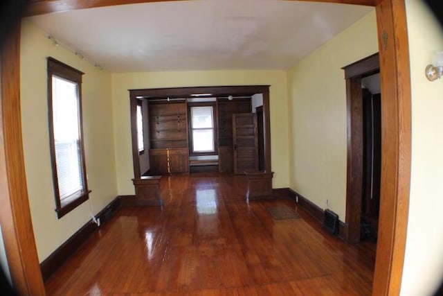 hall featuring dark wood-type flooring