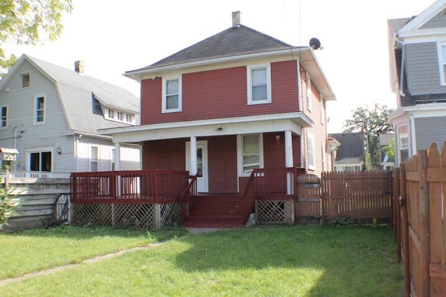 back of house featuring a yard