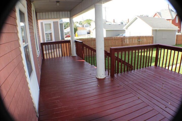 wooden terrace featuring a shed