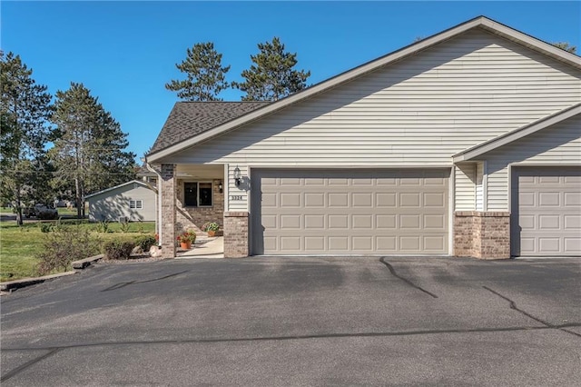 view of side of property with a garage