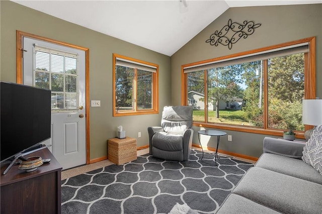 living area with carpet and lofted ceiling