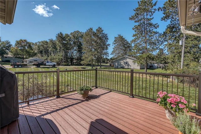 wooden terrace with a yard