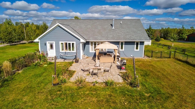 rear view of property with a lawn, a patio, and an outdoor hangout area