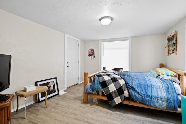 bedroom with light hardwood / wood-style flooring