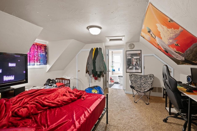 bedroom with a textured ceiling, lofted ceiling, and carpet flooring